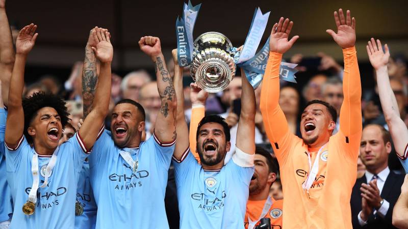 Ilkay Gundogan's double puts City on the brink of treble with FA Cup win.
